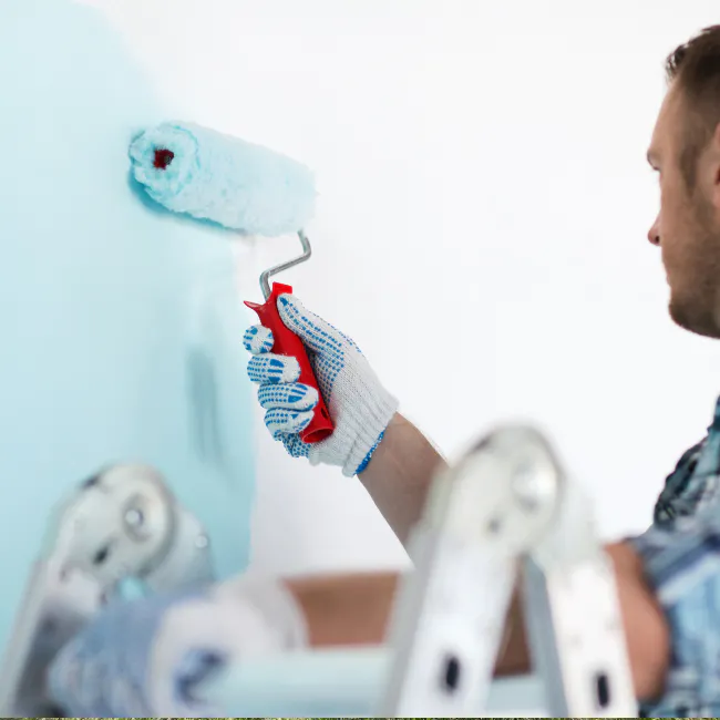 painting contractor using a paint roller during interior painting service bethlehem pa
